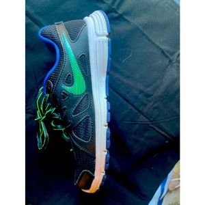 Worn only 3 times. Black and royal blue tennis shoes with lime green accents